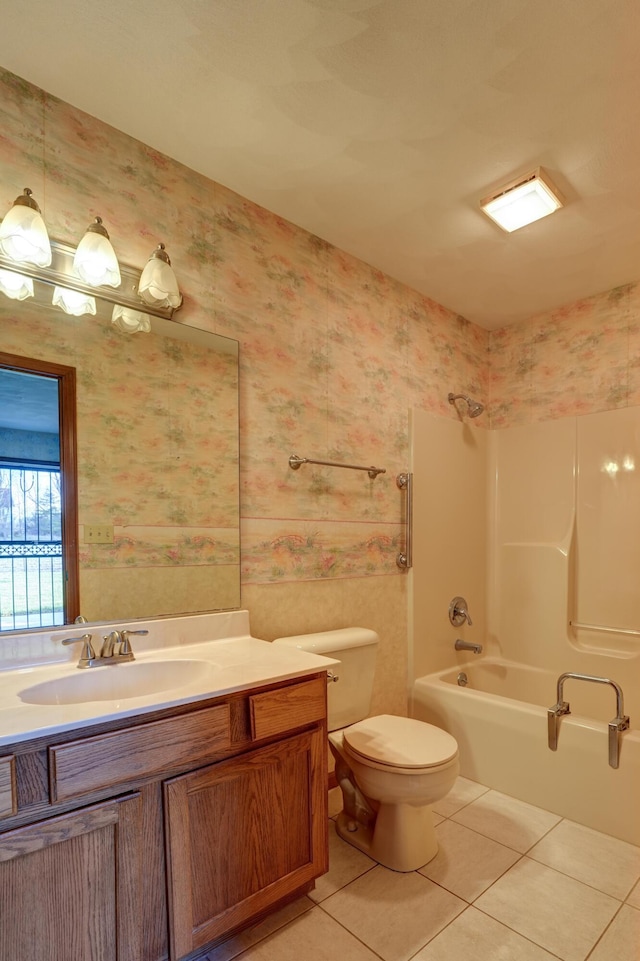 full bath featuring wallpapered walls, vanity, and tile patterned flooring
