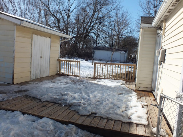 view of snow covered deck