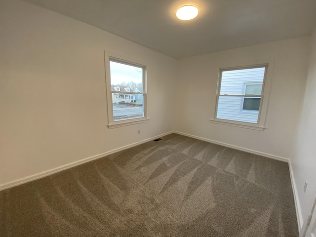 spare room featuring carpet flooring