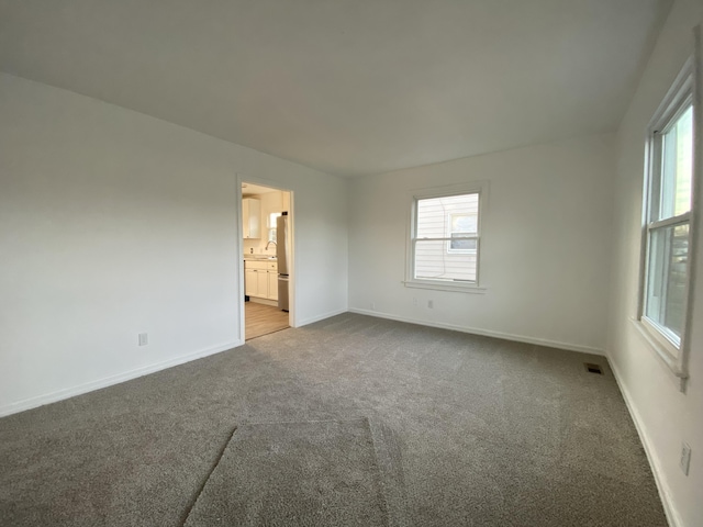 empty room with carpet flooring