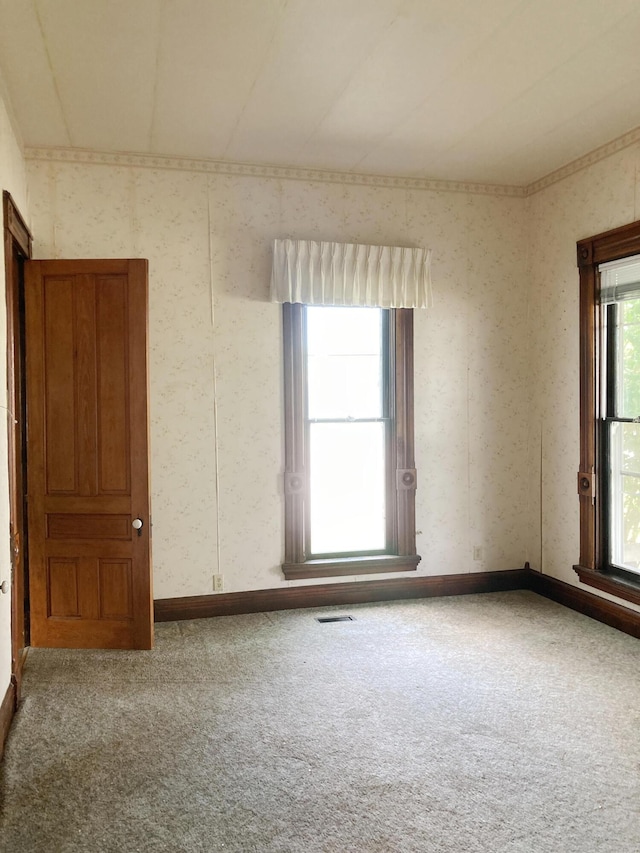 119 E Orchard St, West Manchester, OH 45382 - spare room featuring carpet, wallpapered walls, and baseboards
