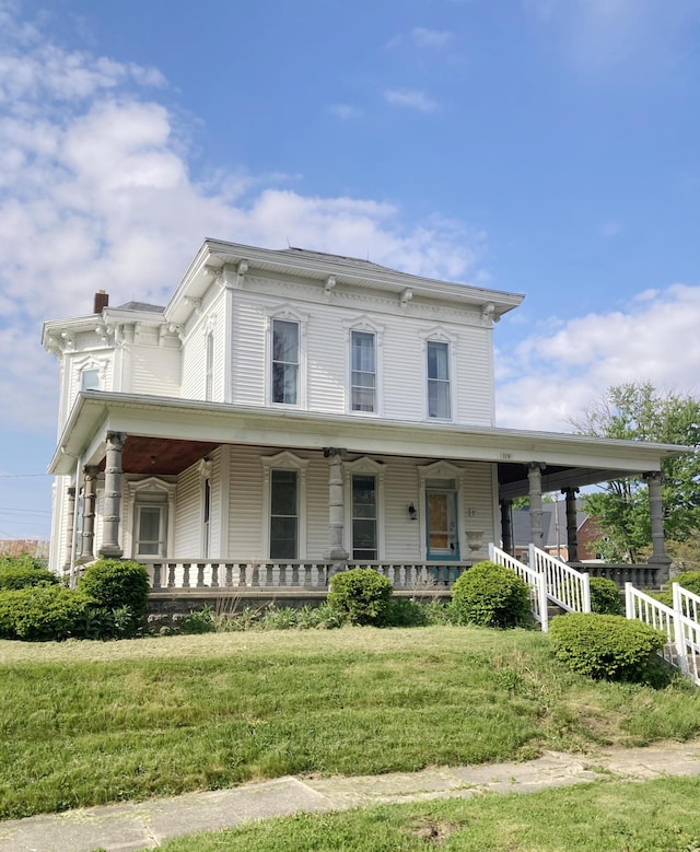 119 E Orchard St, West Manchester, OH 45382 - italianate house with covered porch and a front lawn
