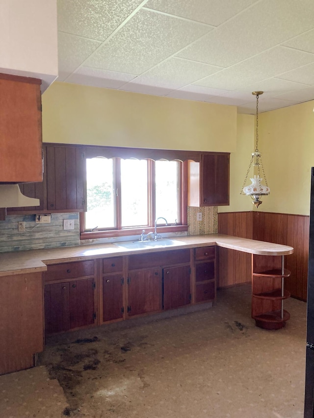 119 E Orchard St, West Manchester, OH 45382 - kitchen with wainscoting, a sink, a drop ceiling, decorative light fixtures, and light countertops