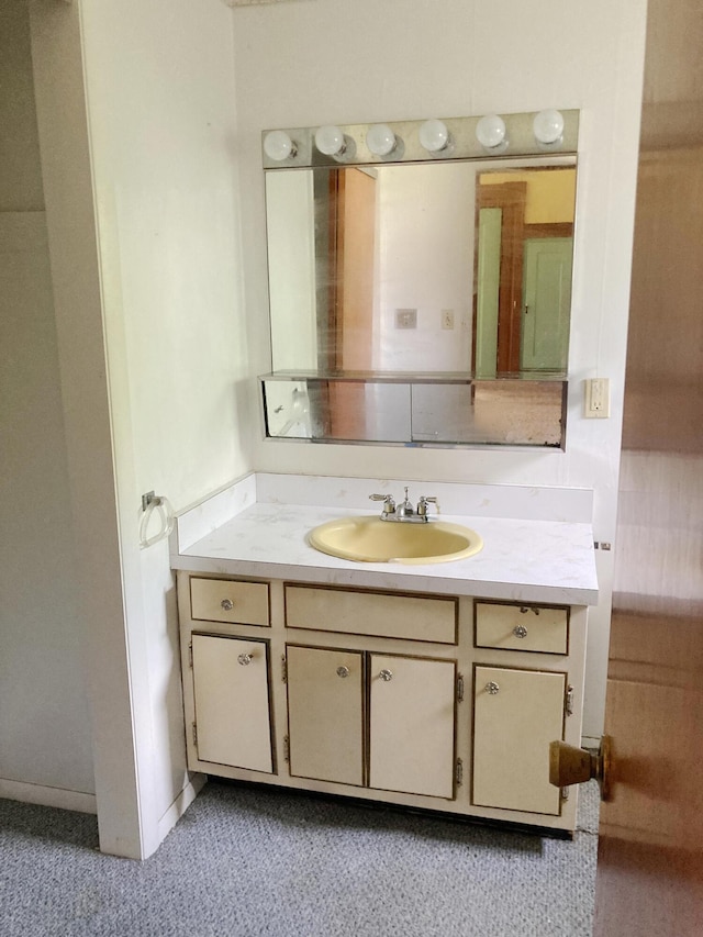 119 E Orchard St, West Manchester, OH 45382 - bathroom with vanity and carpet