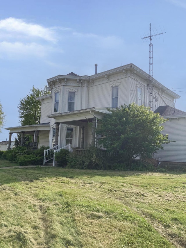 119 E Orchard St, West Manchester, OH 45382 - italianate house featuring a front lawn and a porch