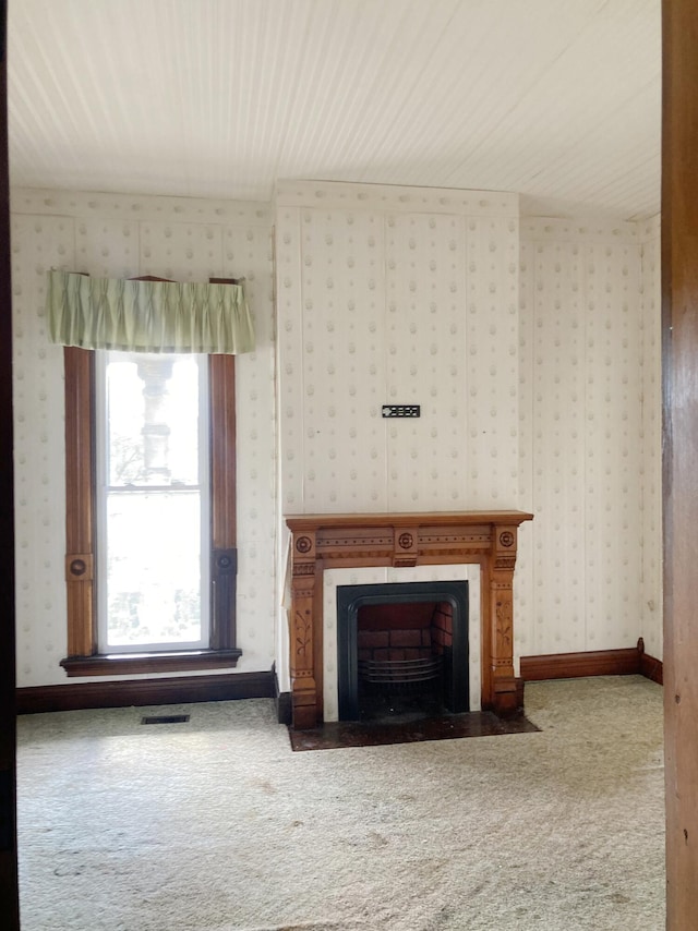 119 E Orchard St, West Manchester, OH 45382 - unfurnished living room featuring carpet floors, wallpapered walls, and a fireplace