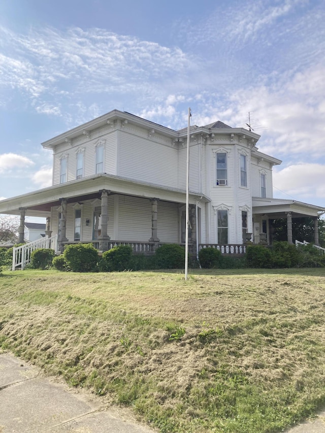 119 E Orchard St, West Manchester, OH 45382 - italianate home featuring a porch and a front lawn