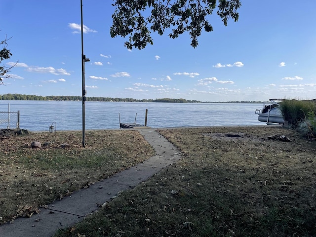 property view of water with a dock