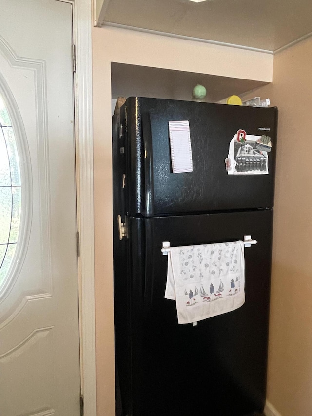 interior details featuring freestanding refrigerator