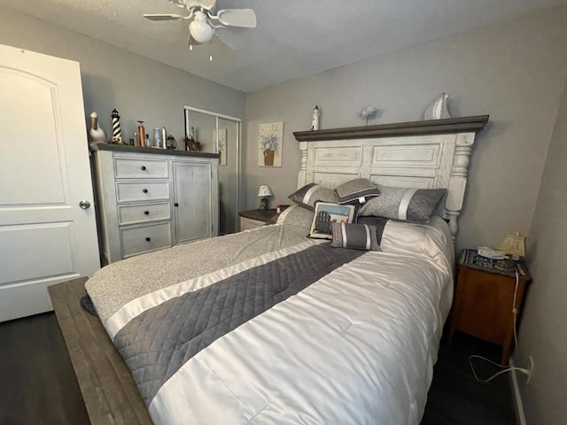 bedroom with a ceiling fan and a closet