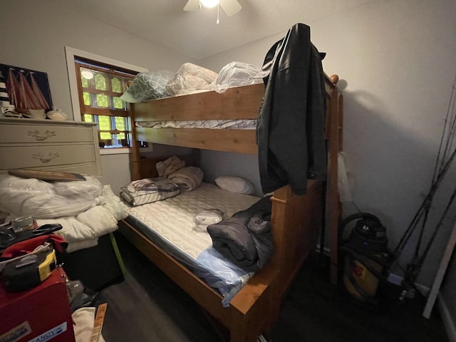 bedroom with ceiling fan and wood finished floors