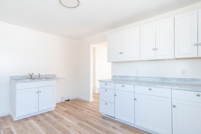 kitchen featuring light countertops and white cabinetry