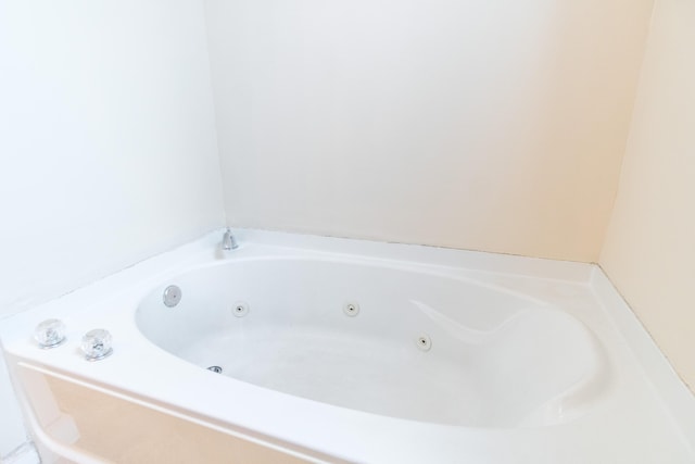 full bath with a jetted tub