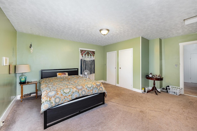 815 Mckaig Ave, Troy, OH 45373 - carpeted bedroom featuring baseboards and a textured ceiling