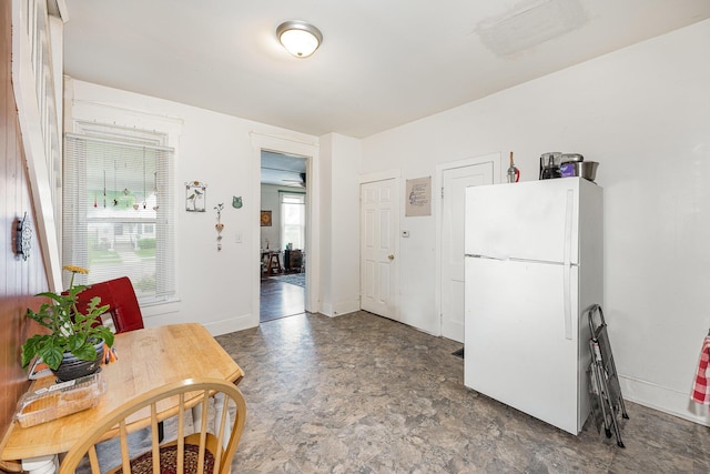 815 Mckaig Ave, Troy, OH 45373 - kitchen with freestanding refrigerator and baseboards