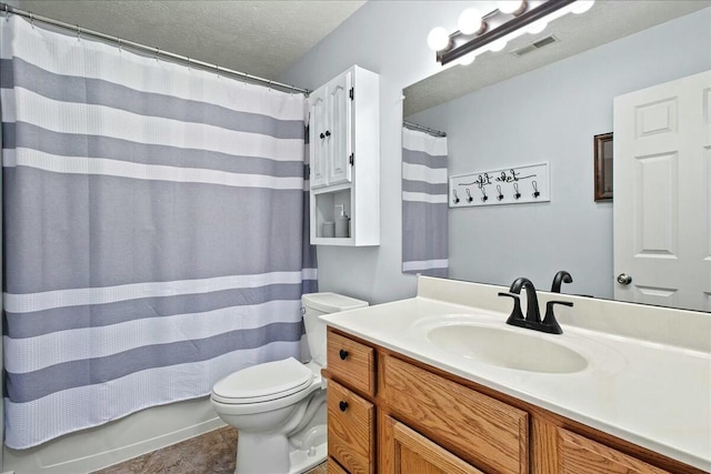 full bath featuring visible vents, toilet, a textured ceiling, vanity, and tile patterned flooring