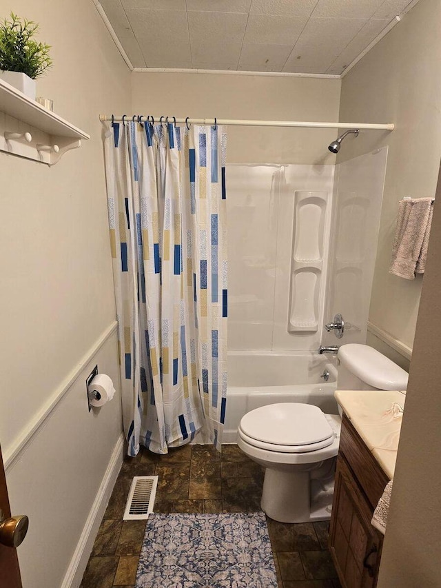 1134 Cedarview Dr, Springfield, OH 45503 - bathroom featuring shower / bath combo with shower curtain, toilet, vanity, stone finish floors, and ornamental molding