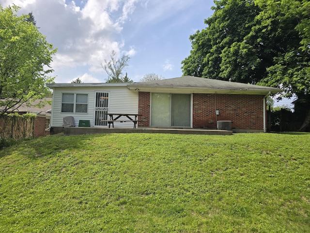 1134 Cedarview Dr, Springfield, OH 45503 - back of property with brick siding and central air condition unit
