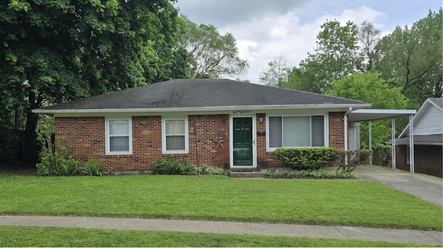 1134 Cedarview Dr, Springfield, OH 45503 - ranch-style home with concrete driveway, a front yard, an attached carport, brick siding, and a shingled roof