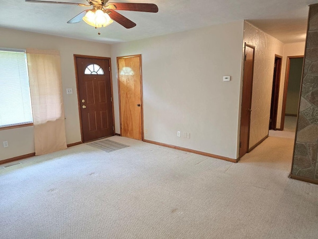 1134 Cedarview Dr, Springfield, OH 45503 - foyer entrance featuring light carpet, a ceiling fan, and baseboards