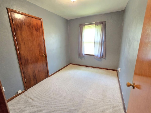 1134 Cedarview Dr, Springfield, OH 45503 - unfurnished bedroom featuring carpet, baseboards, and a closet