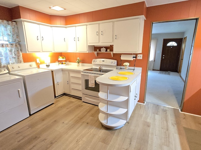 1134 Cedarview Dr, Springfield, OH 45503 - kitchen with white range with electric cooktop, separate washer and dryer, open shelves, light wood-type flooring, and wooden walls
