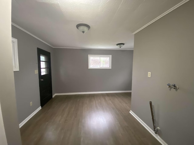 823 Robinson Ave, Piqua, OH 45356 - unfurnished room with healthy amount of natural light, wood finished floors, ornamental molding, and baseboards