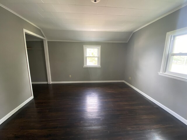 823 Robinson Ave, Piqua, OH 45356 - spare room featuring crown molding, dark wood finished floors, and baseboards