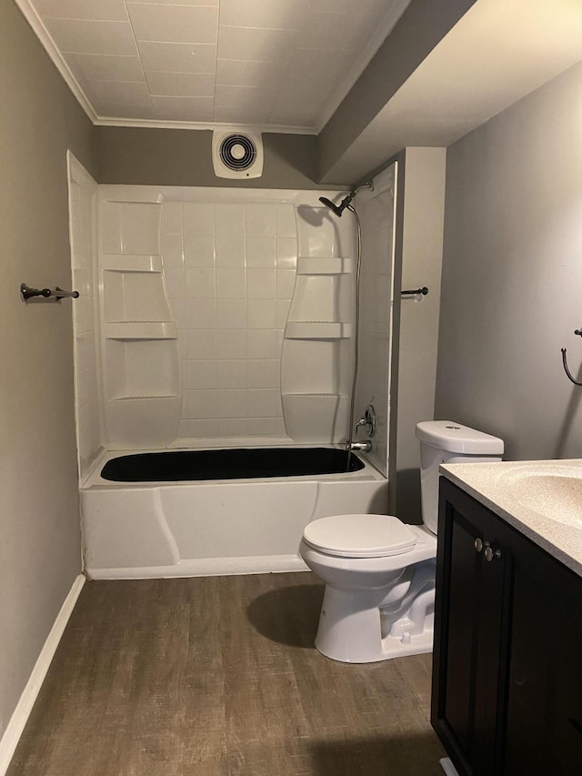 823 Robinson Ave, Piqua, OH 45356 - bathroom featuring ornamental molding, wood finished floors, tub / shower combination, vanity, and toilet