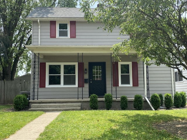 823 Robinson Ave, Piqua, OH 45356 - view of front facade featuring a porch and a shingled roof
