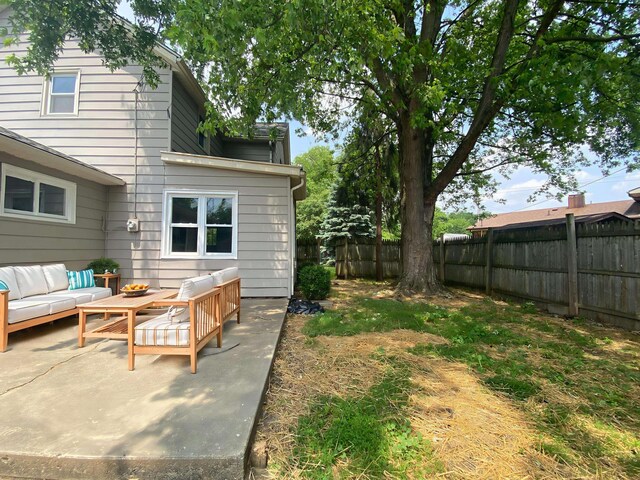 823 Robinson Ave, Piqua, OH 45356 - fenced backyard featuring an outdoor hangout area and a patio area