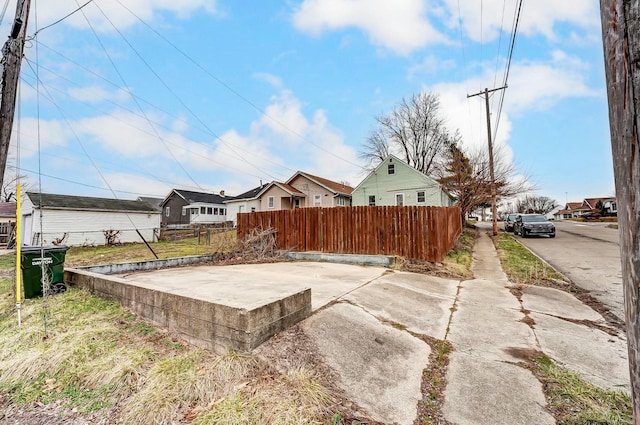 view of yard with fence and a residential view