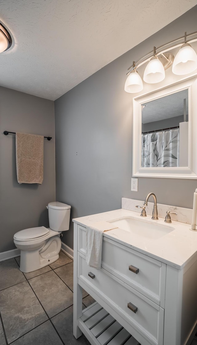 4209 State Route 41, Troy, OH 45373 - full bath featuring toilet, baseboards, tile patterned floors, and vanity