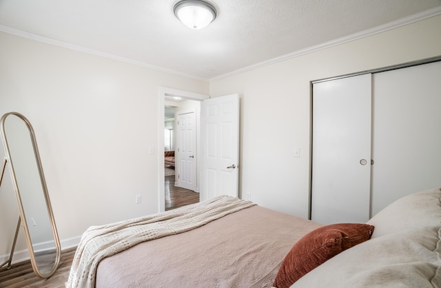 4209 State Route 41, Troy, OH 45373 - bedroom featuring crown molding, wood finished floors, a closet, and baseboards