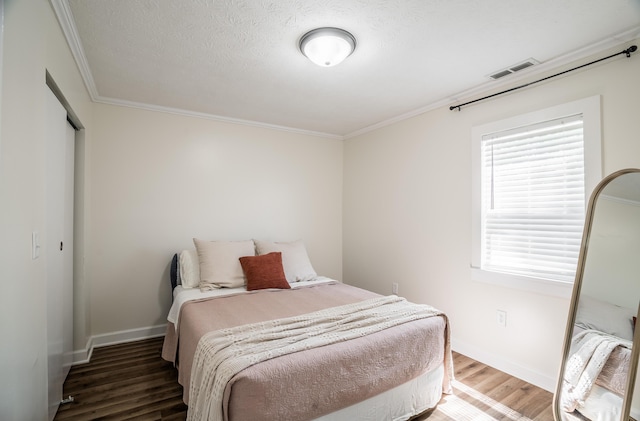 4209 State Route 41, Troy, OH 45373 - bedroom with wood finished floors, ornamental molding, baseboards, and a closet
