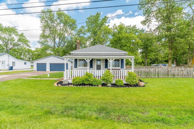 4209 State Route 41, Troy, OH 45373 - view of front facade featuring a porch, a shingled roof, a chimney, a detached garage, and an outbuilding