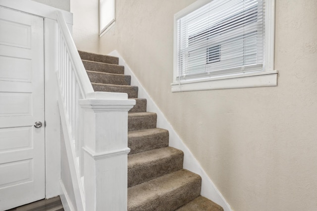 stairs with a textured wall