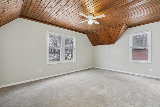 bonus room with lofted ceiling, ceiling fan, baseboards, and carpet flooring