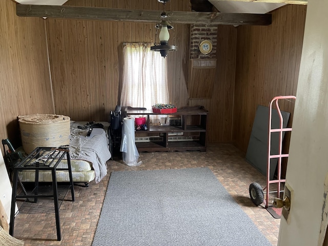 interior space with brick floor and wooden walls