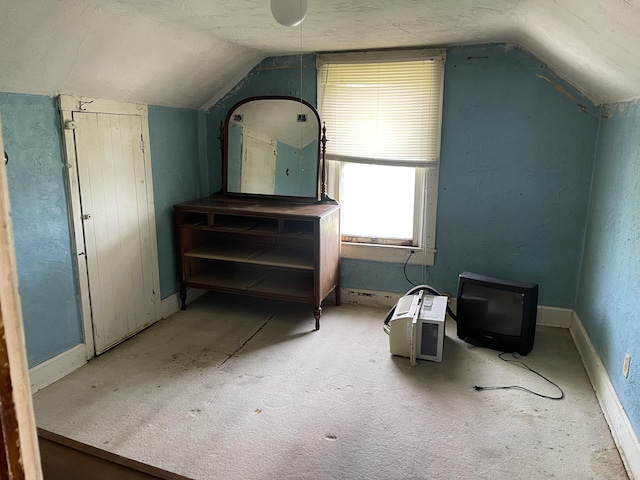 bonus room featuring baseboards, carpet flooring, and vaulted ceiling