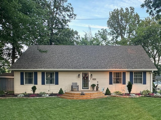 10141 Mohawk Dr, Huntsville, OH 43324 - view of front of home with a front lawn and roof with shingles