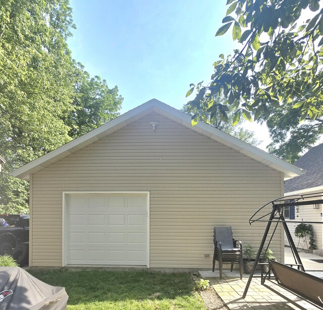 10141 Mohawk Dr, Huntsville, OH 43324 - view of home's exterior with a detached garage and an outdoor structure