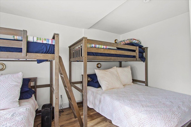 bedroom featuring wood finished floors