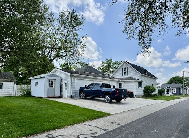 641 Washington St, Versailles, OH 45380 - view of front of property featuring an attached garage and concrete driveway