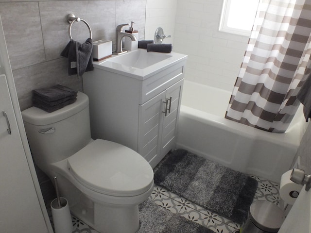 324 E Maplewood Ave, Dayton, OH 45405 - bathroom with tile walls, vanity, shower / tub combo, and toilet