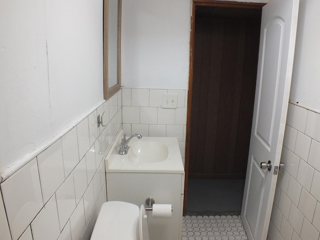 324 E Maplewood Ave, Dayton, OH 45405 - half bathroom with vanity, a wainscoted wall, tile patterned flooring, and tile walls