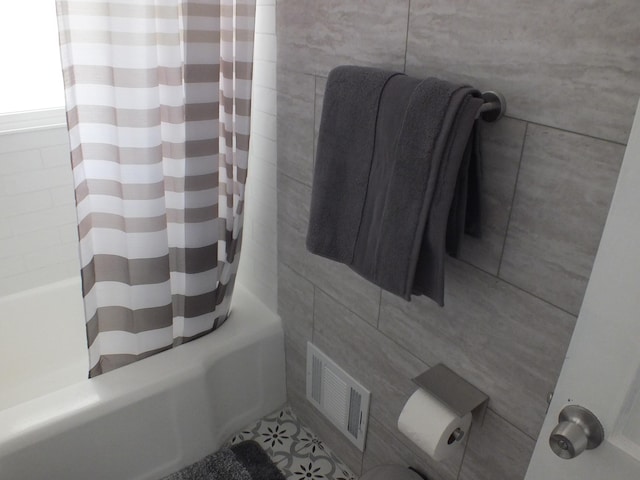 324 E Maplewood Ave, Dayton, OH 45405 - bathroom featuring tile walls, visible vents, and shower / bath combination with curtain