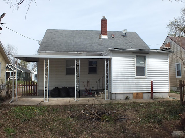 324 E Maplewood Ave, Dayton, OH 45405 - back of house with roof with shingles, a chimney, fence, entry steps, and a patio
