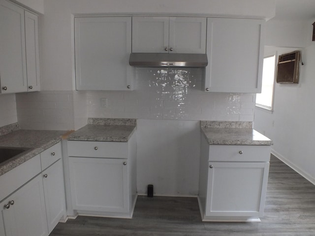 324 E Maplewood Ave, Dayton, OH 45405 - kitchen with a wall mounted air conditioner, backsplash, dark wood-style flooring, and under cabinet range hood