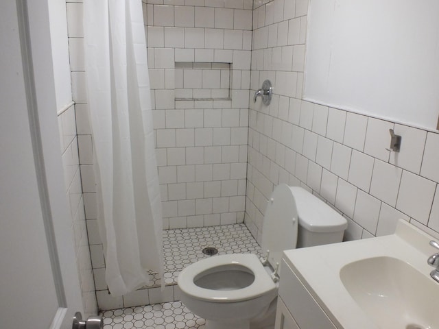 324 E Maplewood Ave, Dayton, OH 45405 - bathroom featuring tile walls, vanity, a shower stall, and toilet